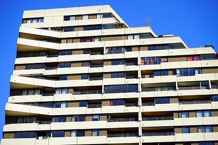 white high-rise building under clear blue sky thumbnail