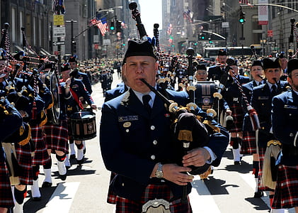 men playing bag pipe under sunny sky thumbnail