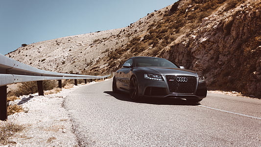 grey Audi sedan on road at daytime thumbnail