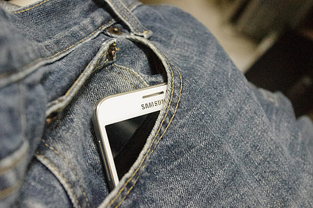 white Samsung smartphone inside the pocke thumbnail