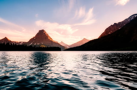 body of water near mountain thumbnail