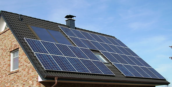blue solar panel on top of roof thumbnail