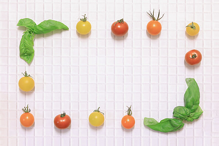 fruit and vegetable photography of tomatoes and green leaves thumbnail
