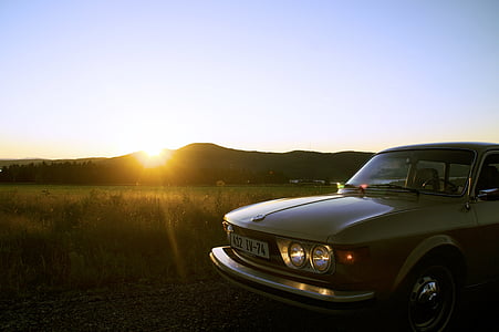 gray car near grass field thumbnail