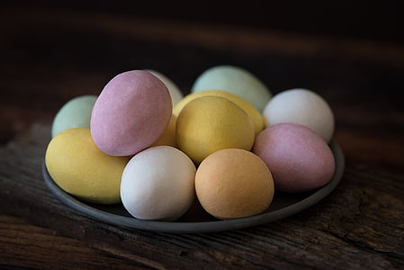 assorted-color eggs on grey plate thumbnail