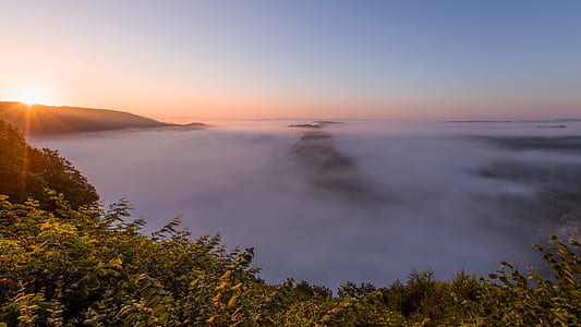 photo of mountains covered with fog during golden thumbnail
