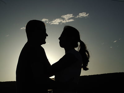 silhouette photo of man and woman facing each other thumbnail