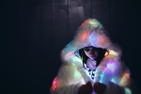 woman wearing white LED fur coat thumbnail