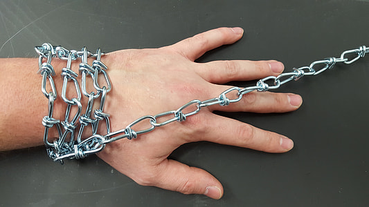 person in gray chain link leash thumbnail