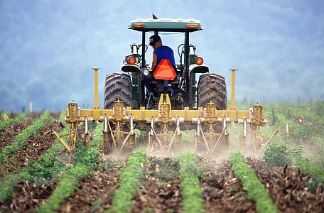 man riding tractor at daytime thumbnail
