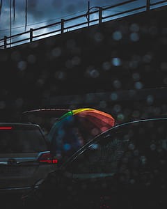 umbrella near SUV thumbnail