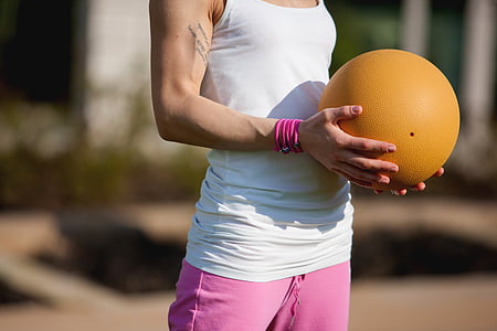 person holding brown ball thumbnail