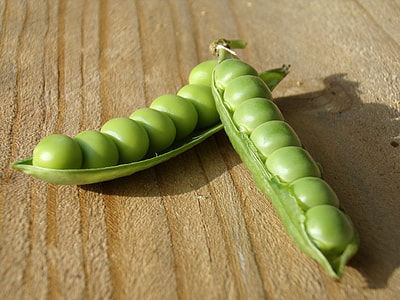 two green beans on brown surface thumbnail