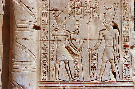 two pharaoh sculpted concrete surface during daytime thumbnail