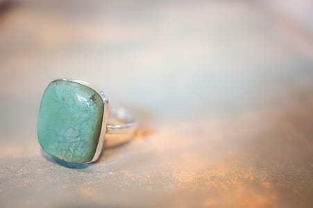 silver-colored ring with green gemstone thumbnail