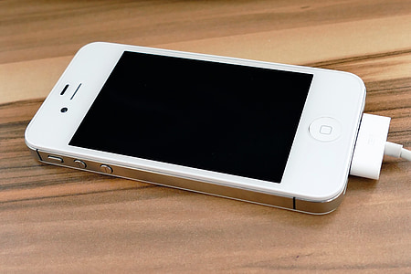 white iPhone 4s plugged in charger thumbnail
