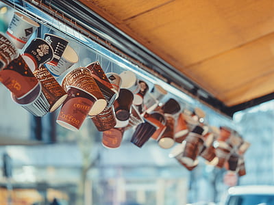 coffee cups hanged on awning roof thumbnail
