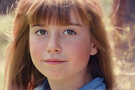focus photo of girl in blue top thumbnail