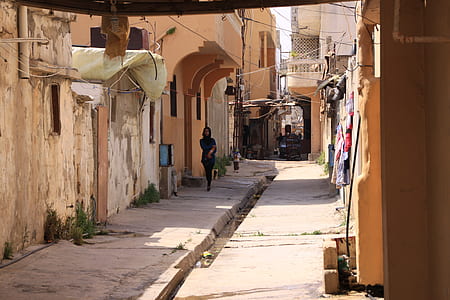 man walking near at houses thumbnail