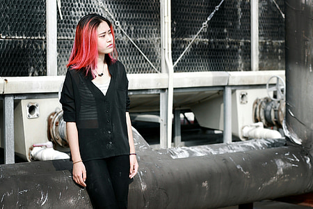 woman standing beside industrial machine thumbnail