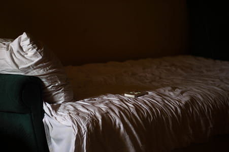 vacant gray bed in the room thumbnail