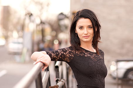 woman in black shirt near gray metal handrails thumbnail