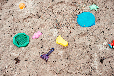 Children toys in sandpit thumbnail