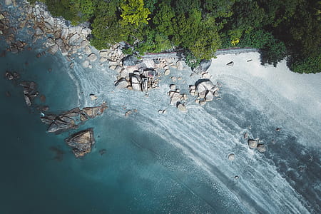 Aerial Photography of Stones on Seashore thumbnail