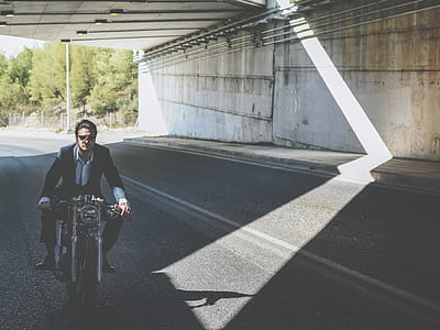man riding motorcycle on asphalt road thumbnail