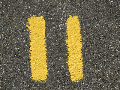 two yellow lines on gray concrete surface thumbnail