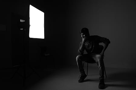 Man Sitting On Chair While Thinking thumbnail