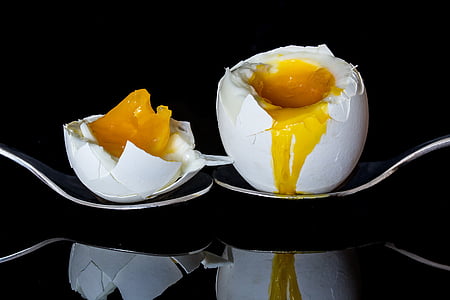 two poultry eggs on spoon thumbnail