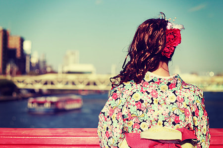 woman in red and black floral traditional dress with flower headdress thumbnail