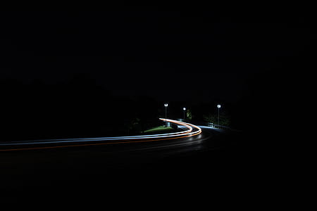 time lapse photography of curved road thumbnail