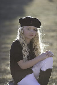girl wearing hat during daytime thumbnail