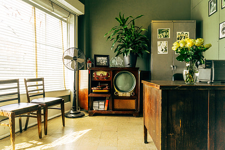 classic television beside pedestal fan inside an office thumbnail