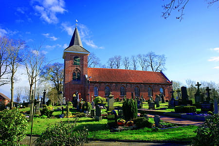 brown chapel surrounded with topiary thumbnail