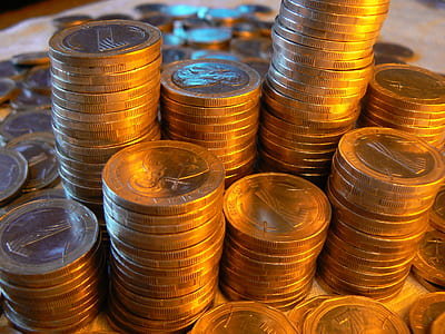 close-up photo of pile of round gold-colored coins thumbnail