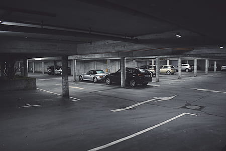 grayscale photography of parked cars thumbnail