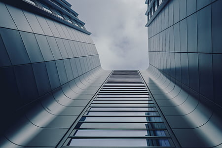 gray concrete building under white clouds at daytime thumbnail