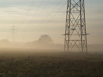 foggy field with transmission towers thumbnail