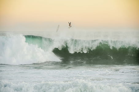 surfer and body of water thumbnail