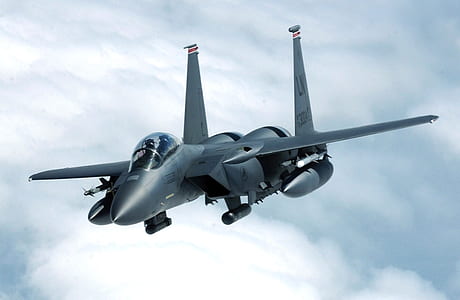 gray fighting plane on skies at daytime thumbnail