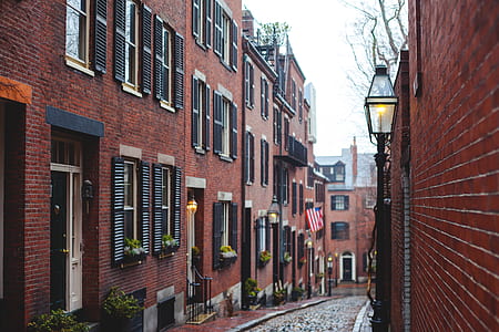 road between red building photography thumbnail