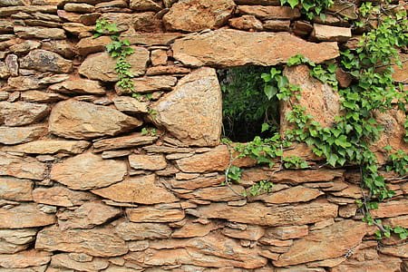 closeup photo pile of brown rock wall thumbnail