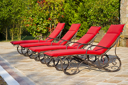 four inline outdoor lounge chairs thumbnail