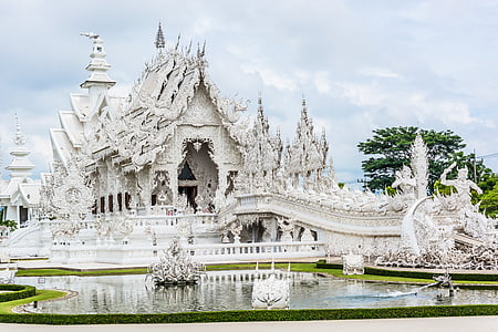 photo of white temple near body of water thumbnail