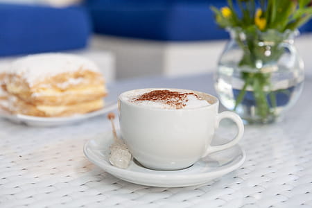 Teacup Filled With Coffee Froth on Saucer thumbnail