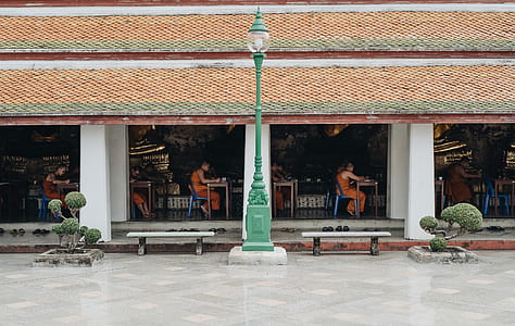 women sitting on chair inside building thumbnail