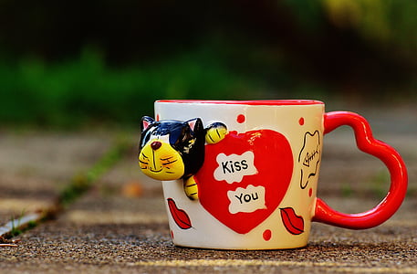 white and red ceramic mug thumbnail